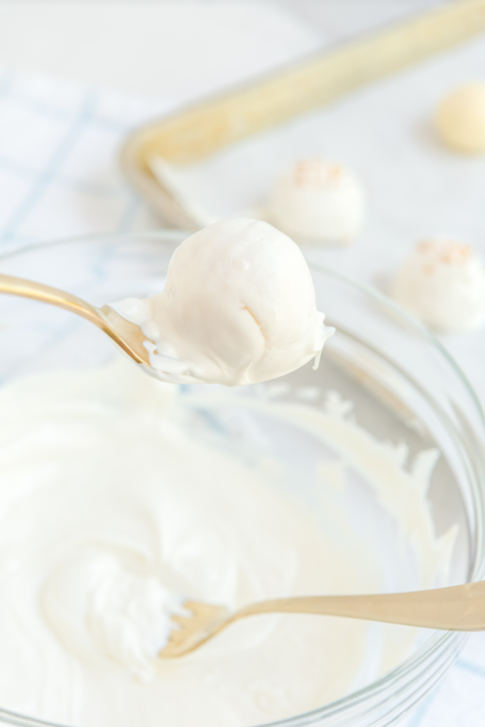 White Chocolate Champagne Truffles being dipped in chocolate