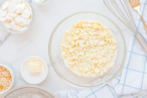 pouring cream mixture over white chocolate