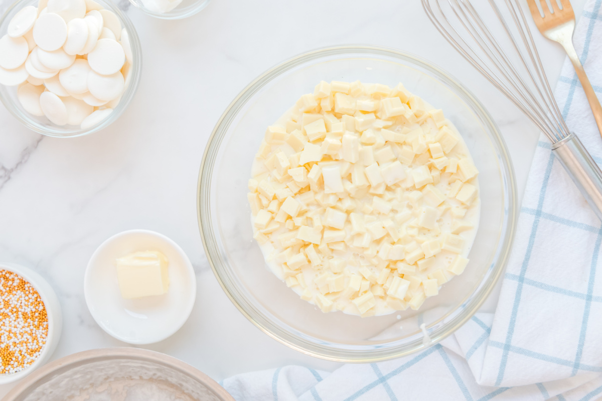 pouring cream mixture over white chocolate