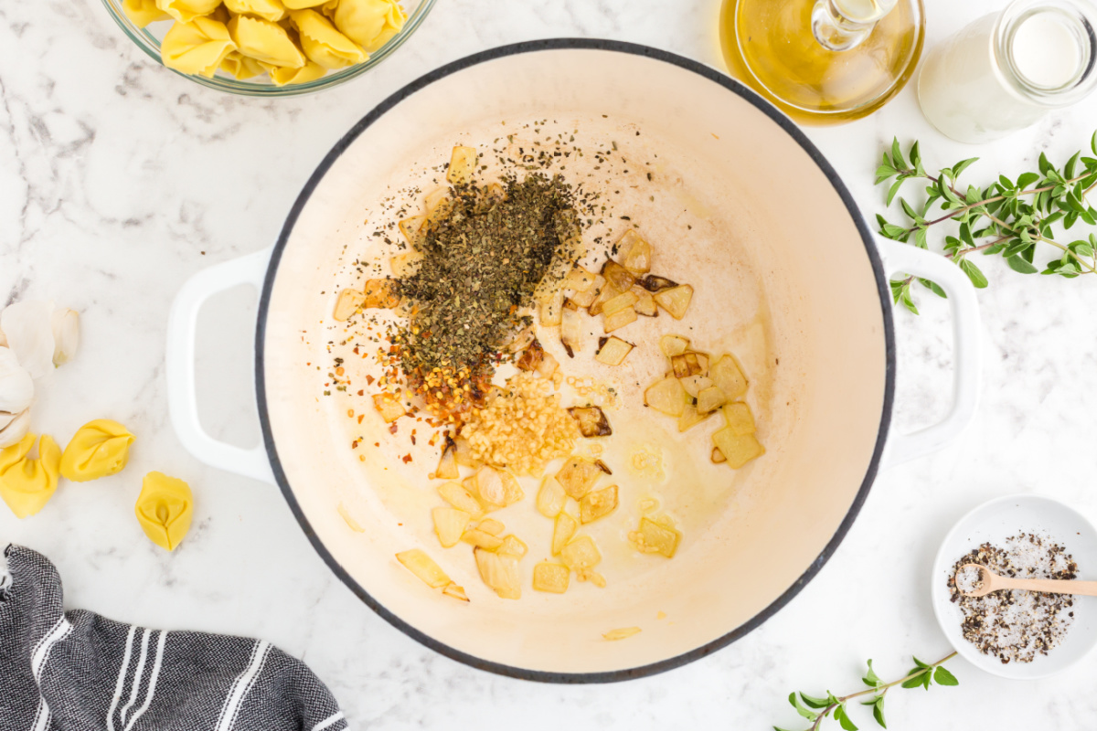 seasoning added to pot with onions