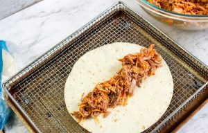 pork added to center of toritilla