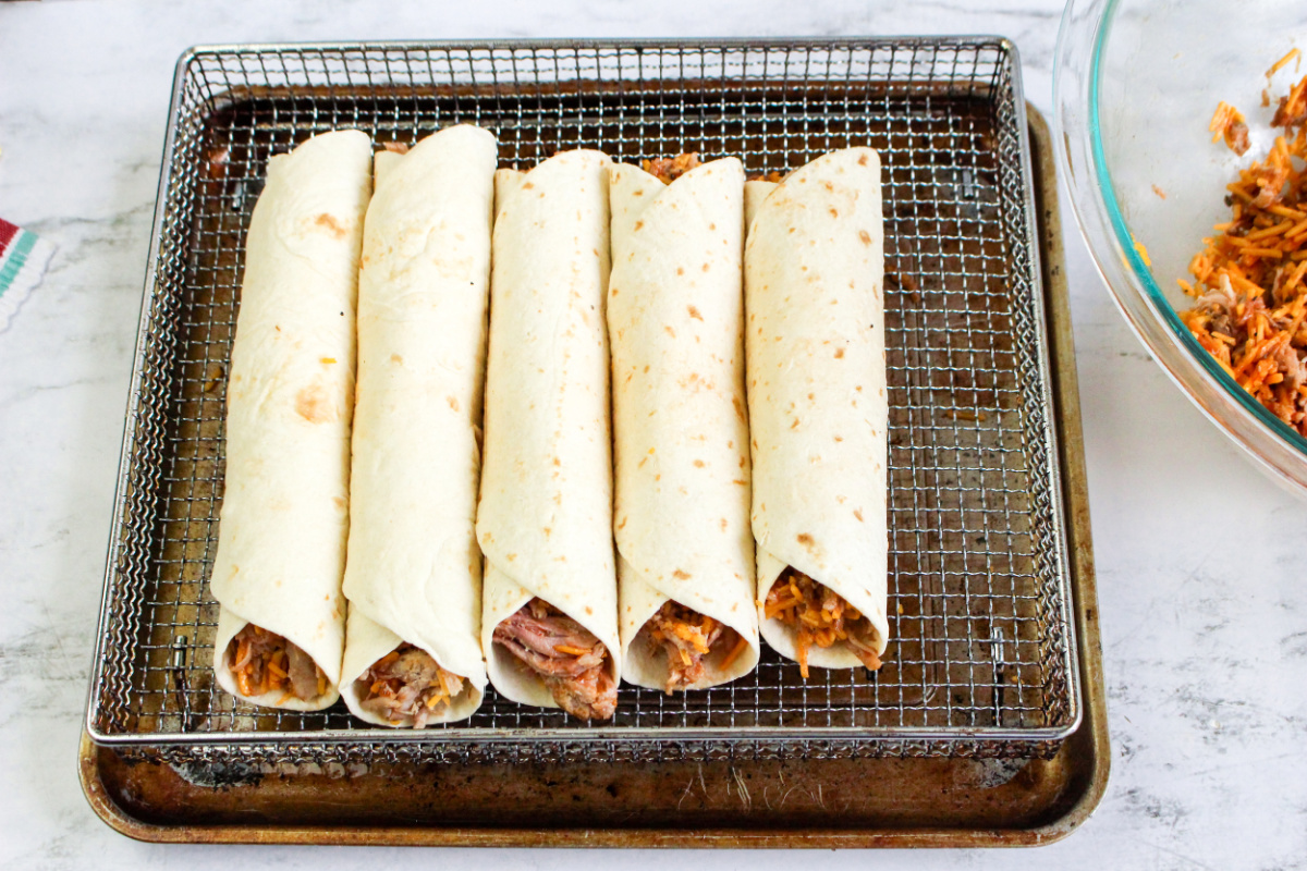 rolled up taquitos on air fryer basket