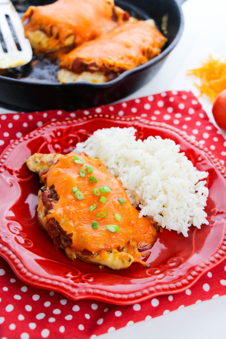 Cheesy Salsa Chicken on a plate with rice