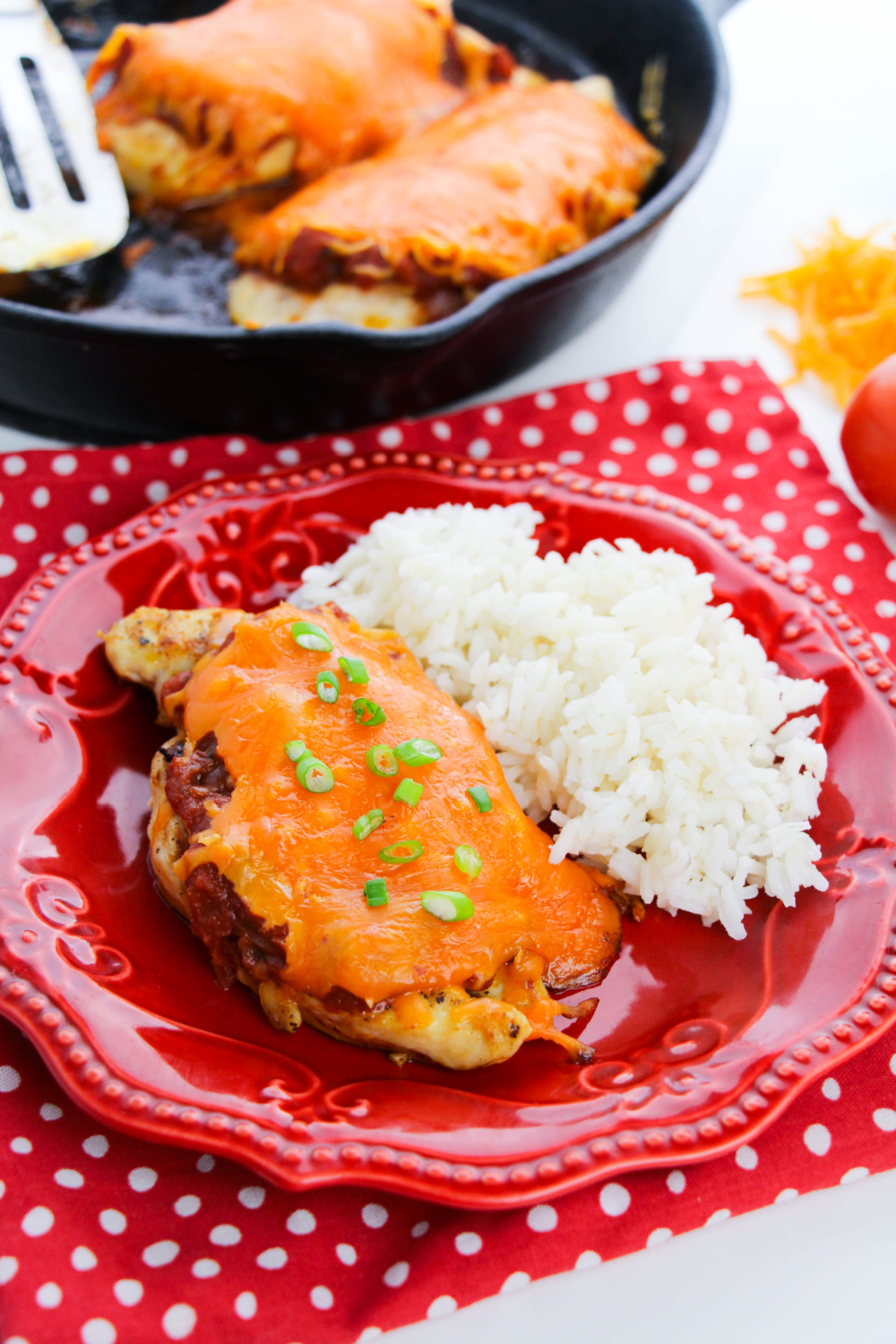 Cheesy Salsa Chicken on a plate with rice