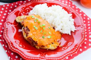 Cheesy Salsa Chicken on a plate with rice