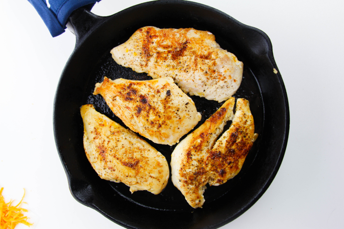 chicken cooking in a pan