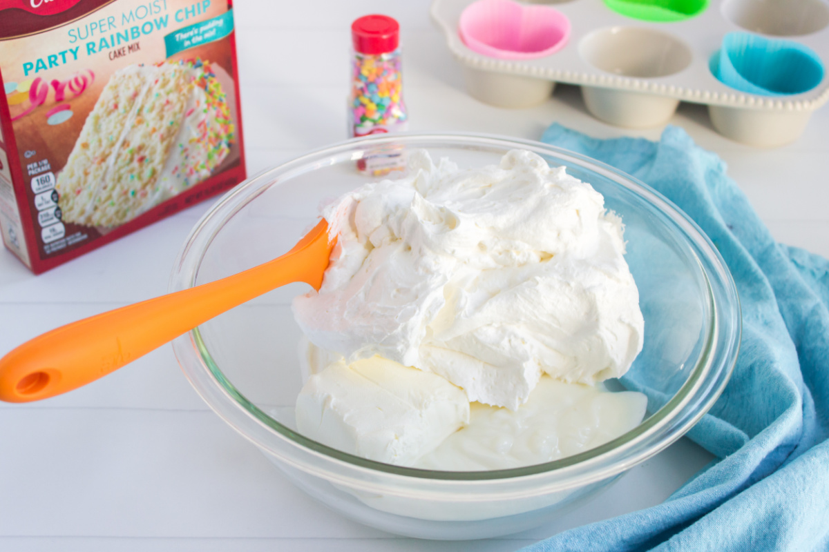 softened cream cheese, vanilla yogurt, and Cool Whip in a large mixing bowl