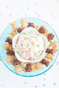 Copycat Dunkaroo Dip in a bowl surrounded buy teddy bear crackers