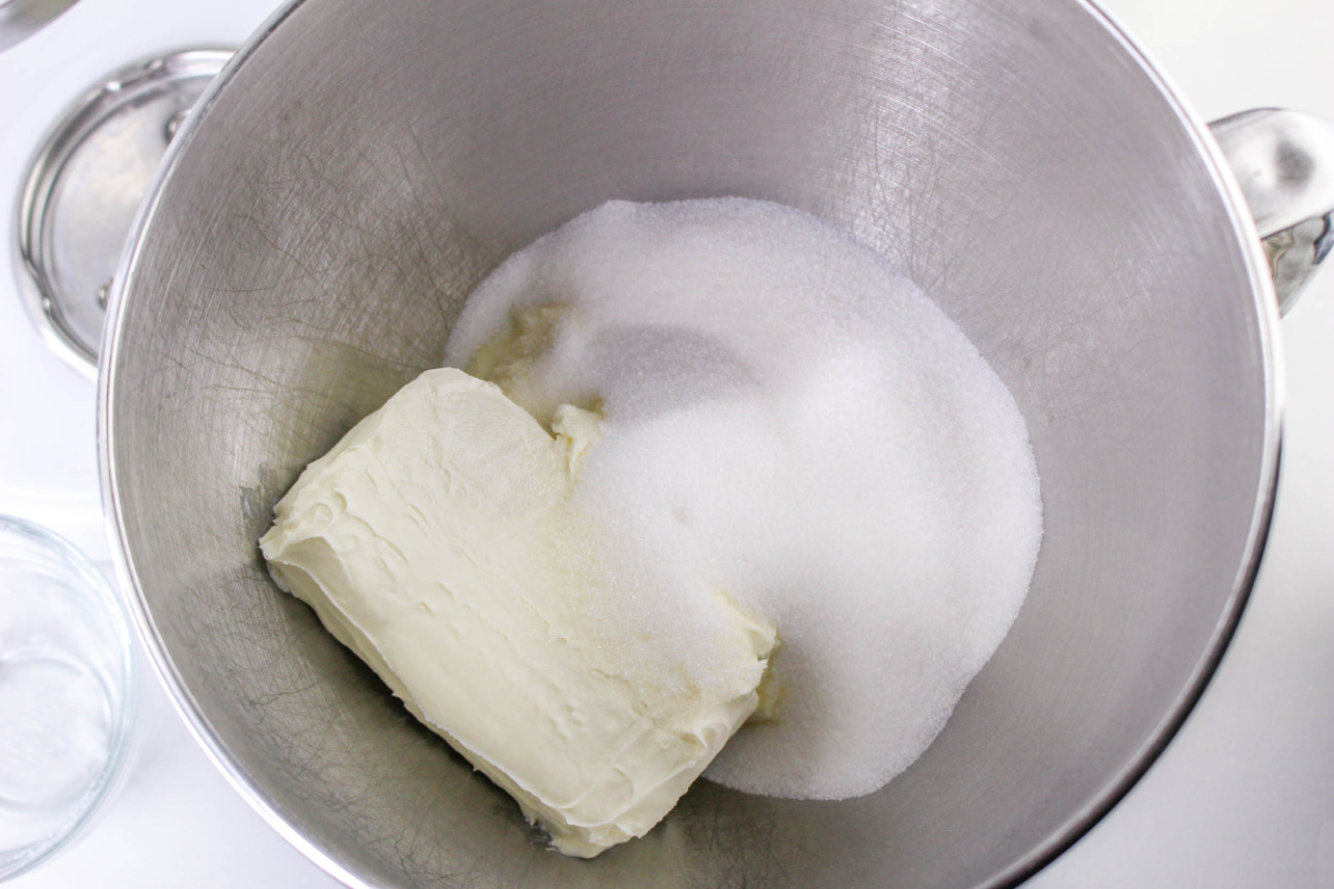 cream cheese and sugar in a mixing bowl