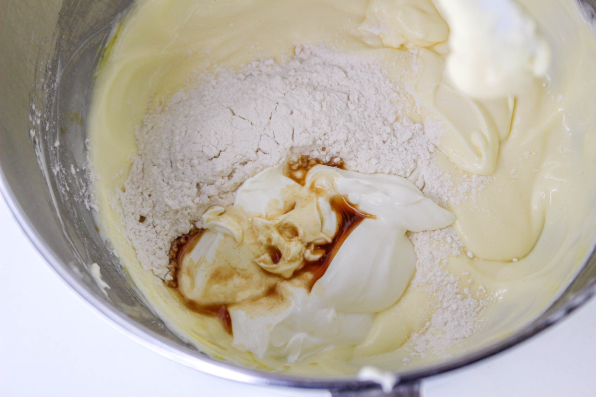 vanilla extract, sour cream, and flour added to bowl
