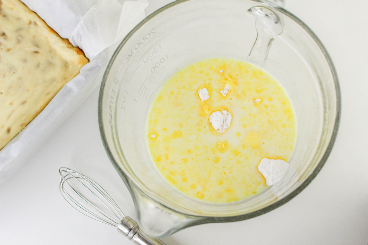 instant banana pudding mix and milk in a bowl