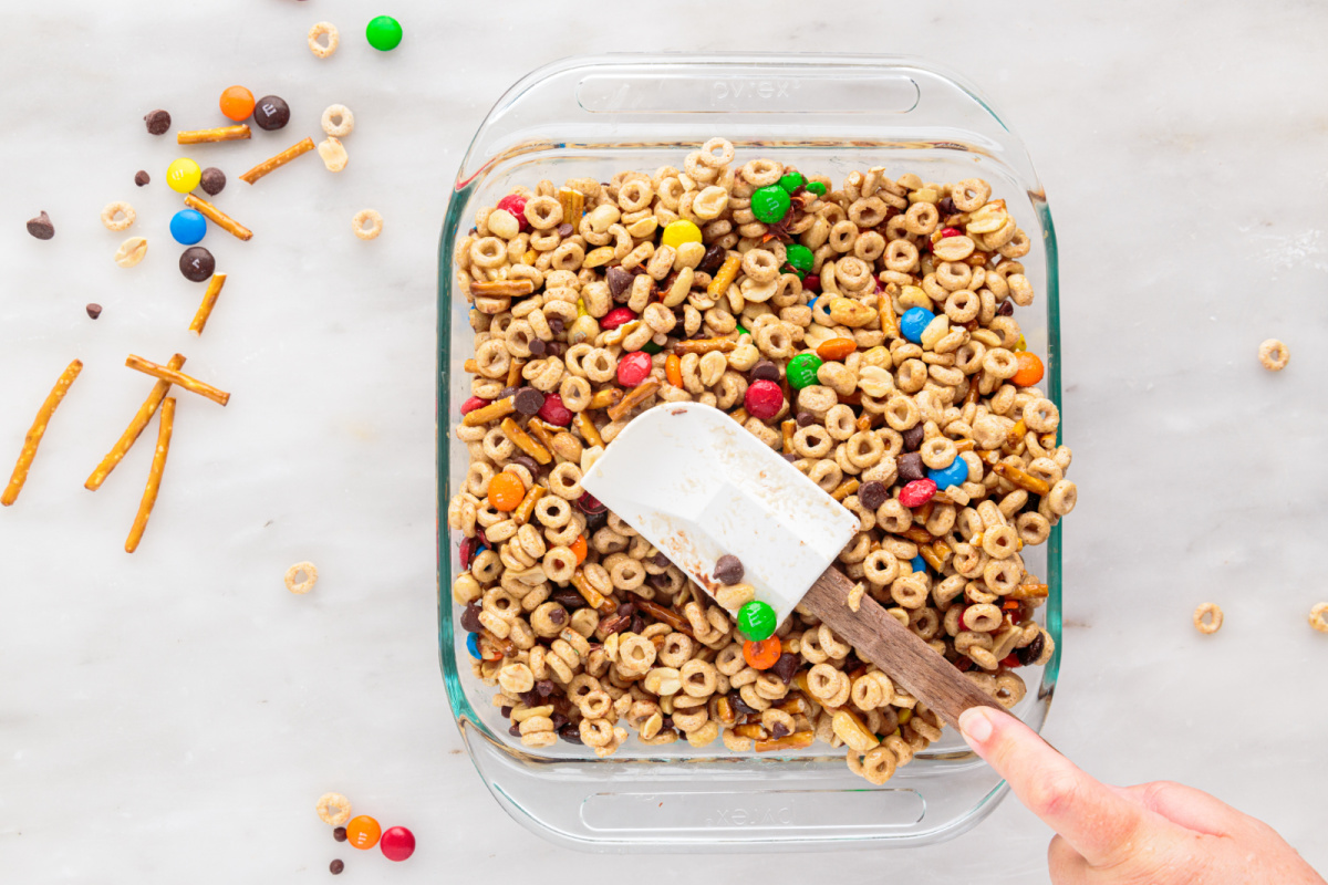 placing cereal mixture in a baking pan