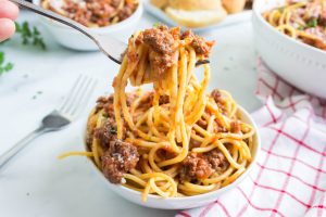 Instant Pot Bolognese Sauce in a bowl with pasta