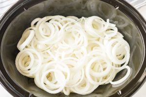sliced onions in slow cooker