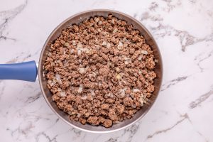 beef cooking in a pan