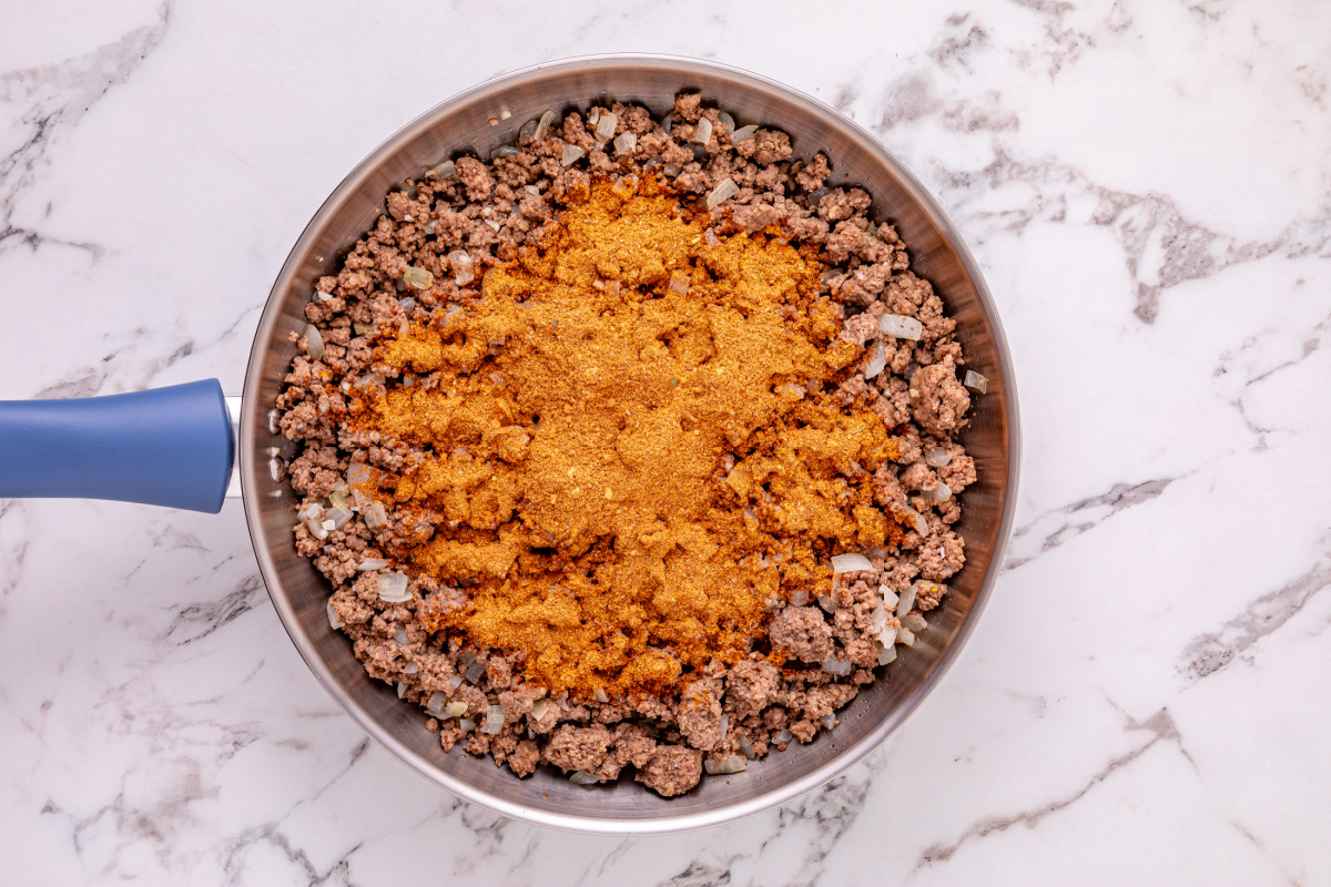 taco seasoning added to pan
