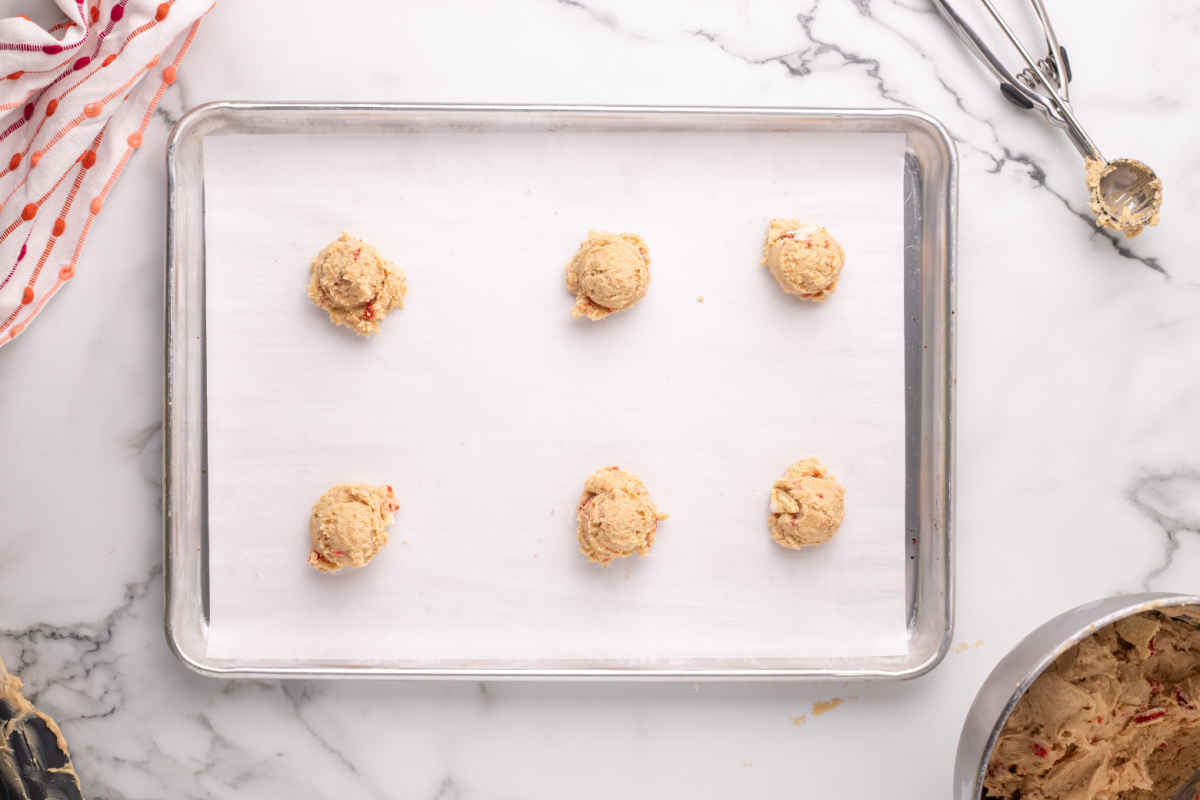 cookie dough balls on baking sheet