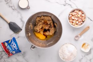 eggs and vanilla added to bowl