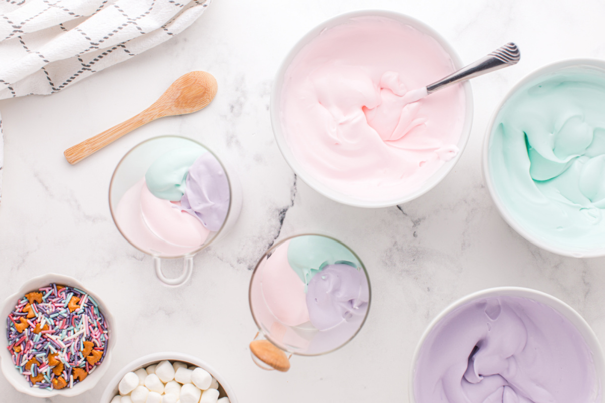 placing 3 different colors of pudding in cups