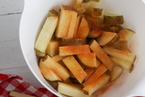 potatoes in a bowl with seasoning