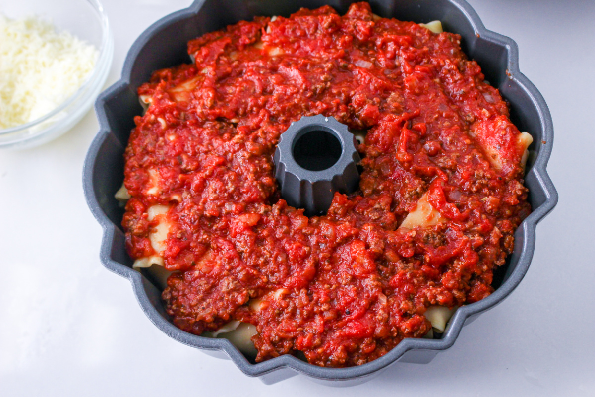 meat sauce added on top of noodles