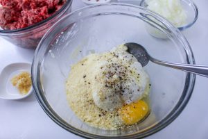 ricotta cheese, egg, and grated Parmesan cheese in a bowl