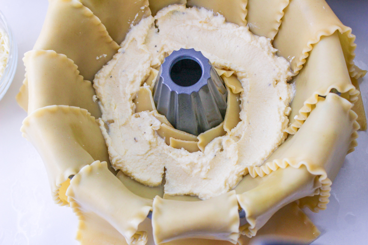 ricotta cheese mixture added to top of noodles