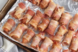 coated sausages on the lined baking sheet.