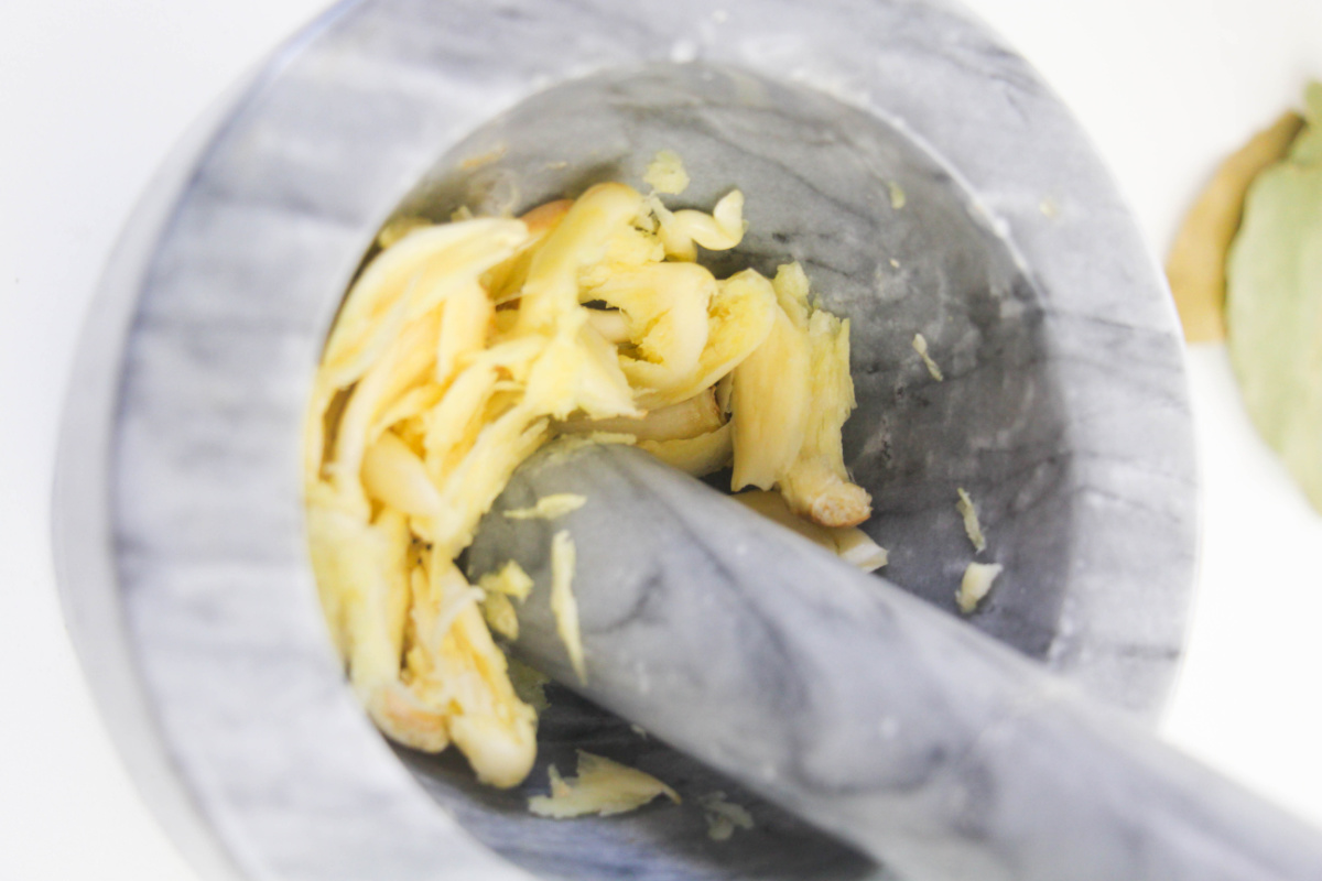 mashing garlic