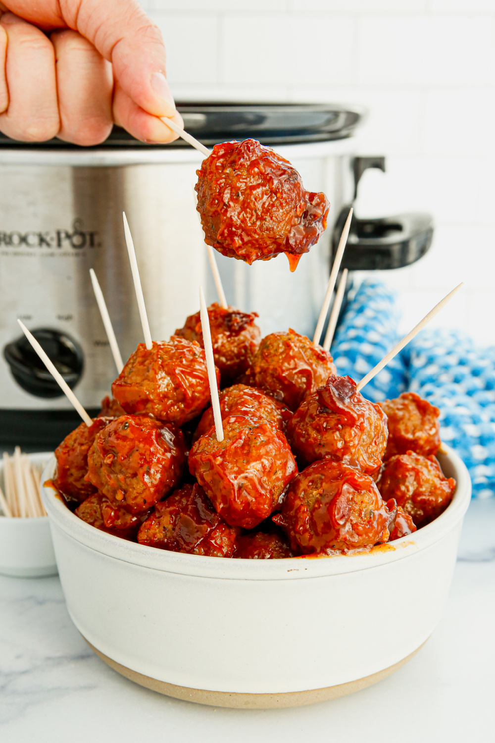 Slow Cooker Apricot Chipotle Meatballs with toothpicks in them