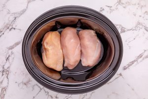 chicken breast placed in slow cooker