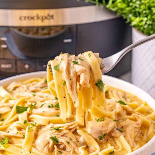 fork scooping up Slow Cooker Chicken and Noodles
