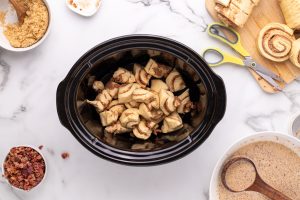 Cinnamon Roll pieces in a slow cooker