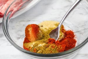 seasonings being mixed in a bowl