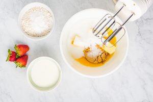 butter, sugar, brown sugar, and egg yolks in a mixing bowl