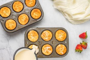 sweetened milk poured over cupcakes