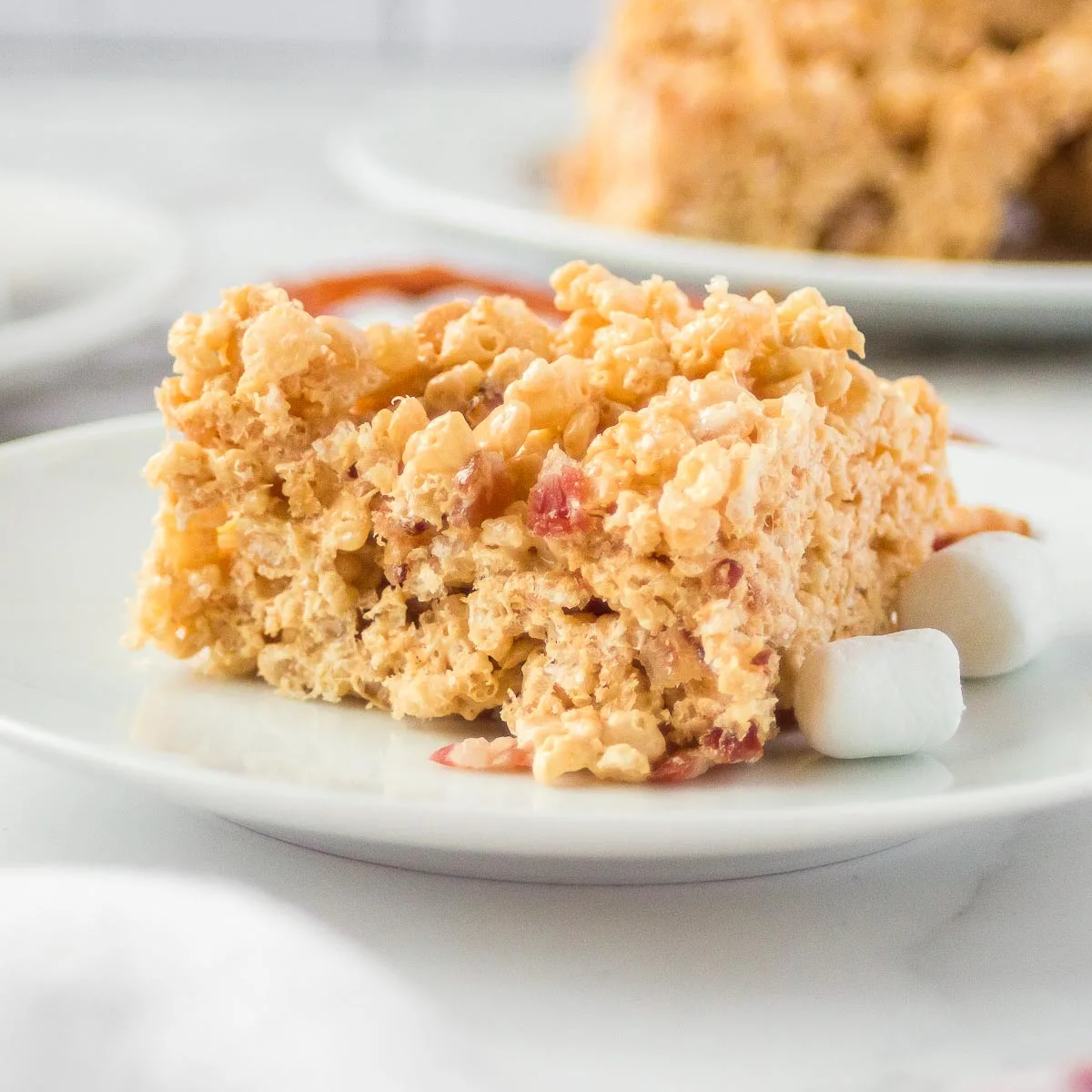 peanut butter bacon rice krispie treat on a plate
