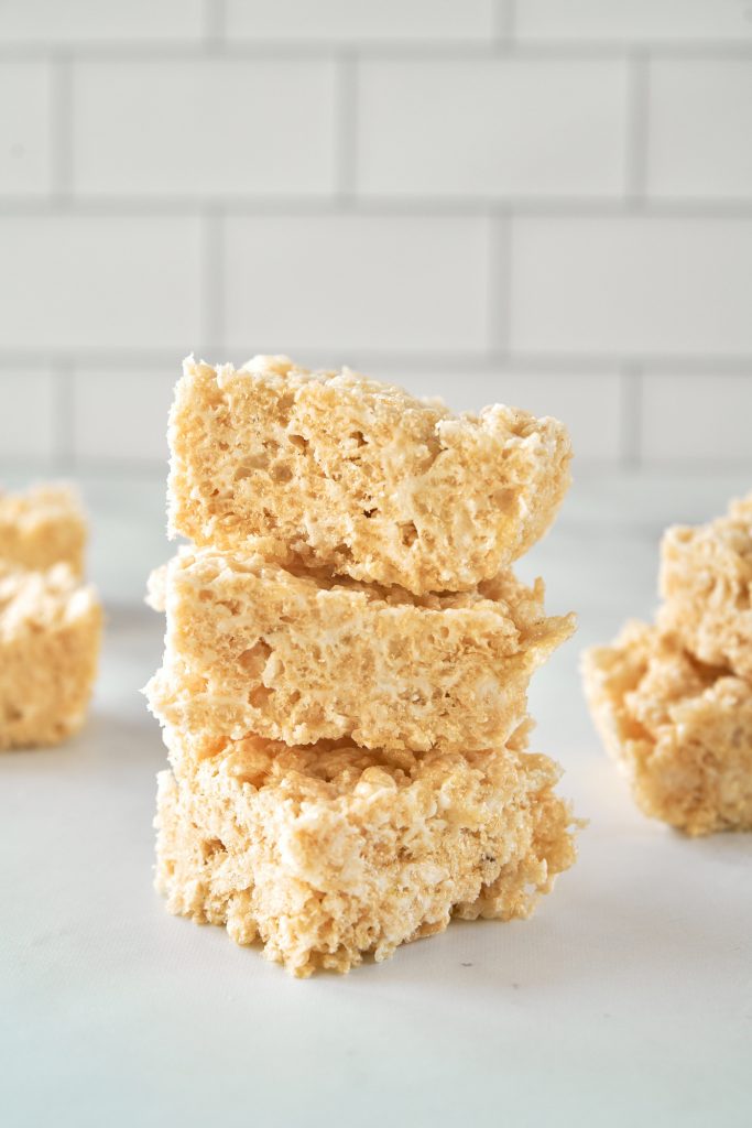 vegan rice krispie treats stacked on a table