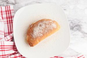cinnamon sugar sprinkled over apple pies