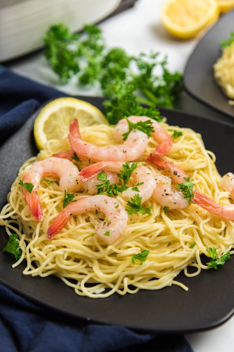 Baked Shrimp Scampi on a plate with pasta