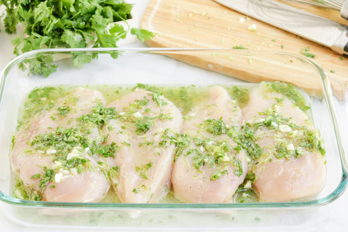 chicken breast in a baking dish with marinade