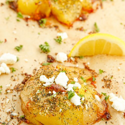 Crispy Greek Smashed Potatoes on a baking sheet