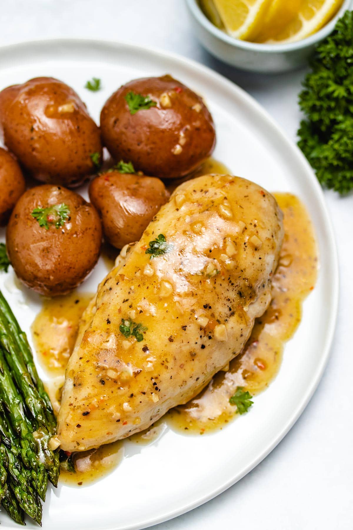 lemon garlic chicken and potatoes on a plate