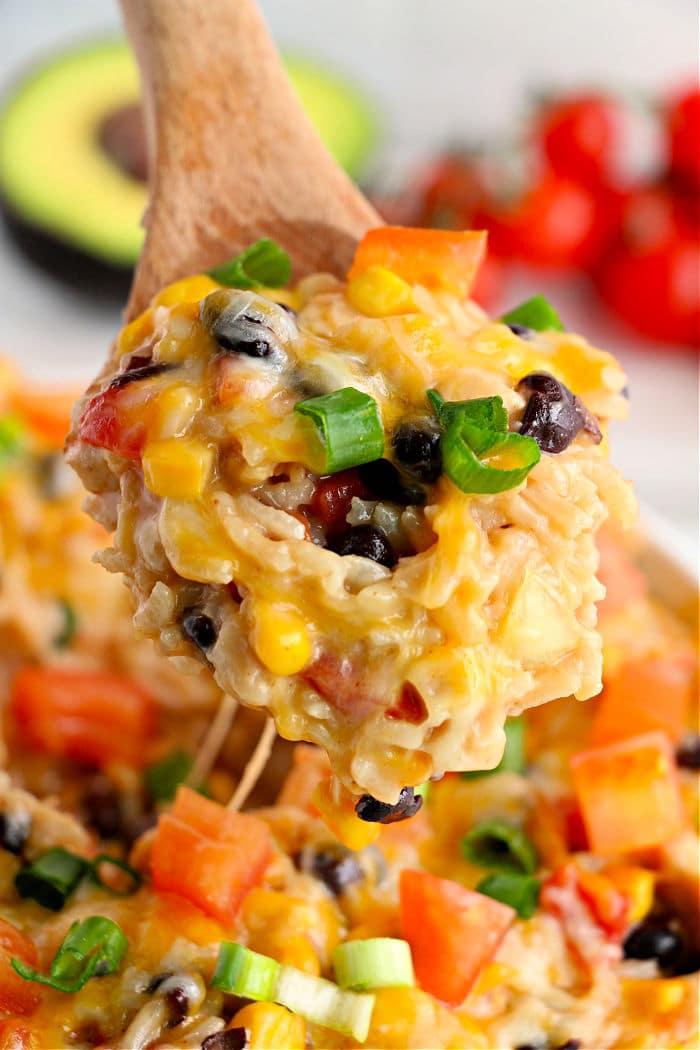 instant pot mexican chicken and rice on a wooden spoon
