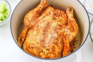 browned chicken in a dutch oven
