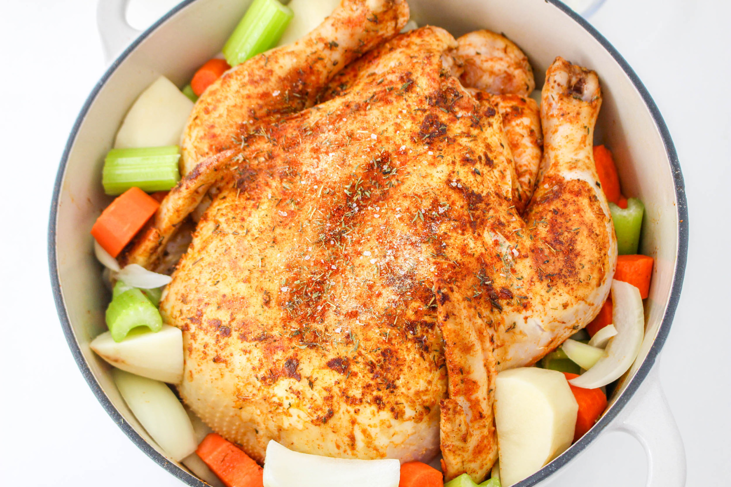 onion, carrots, and potatoes added to pot with chicken