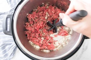 beef and onions cooking in instant pot
