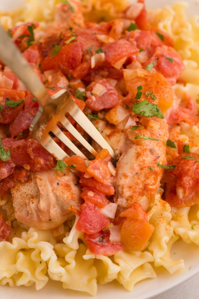 fork picking up some Slow Cooker Chicken Paprikas