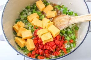 diced tomatoes with green chiles and the cubed Velveeta cheese added to the pan