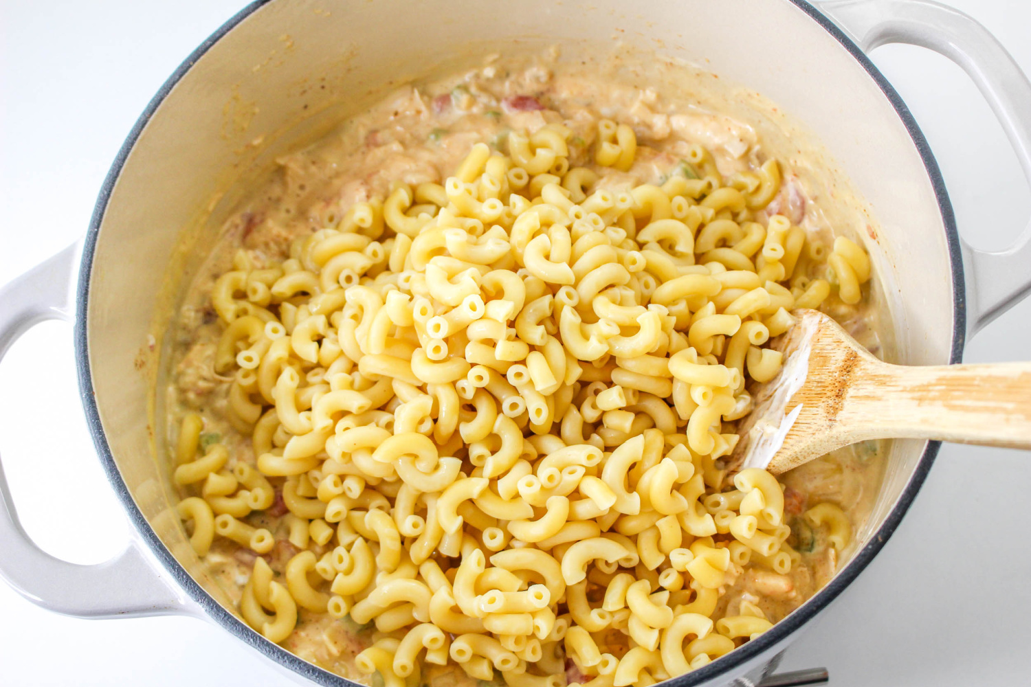 cooked macaroni added to pan